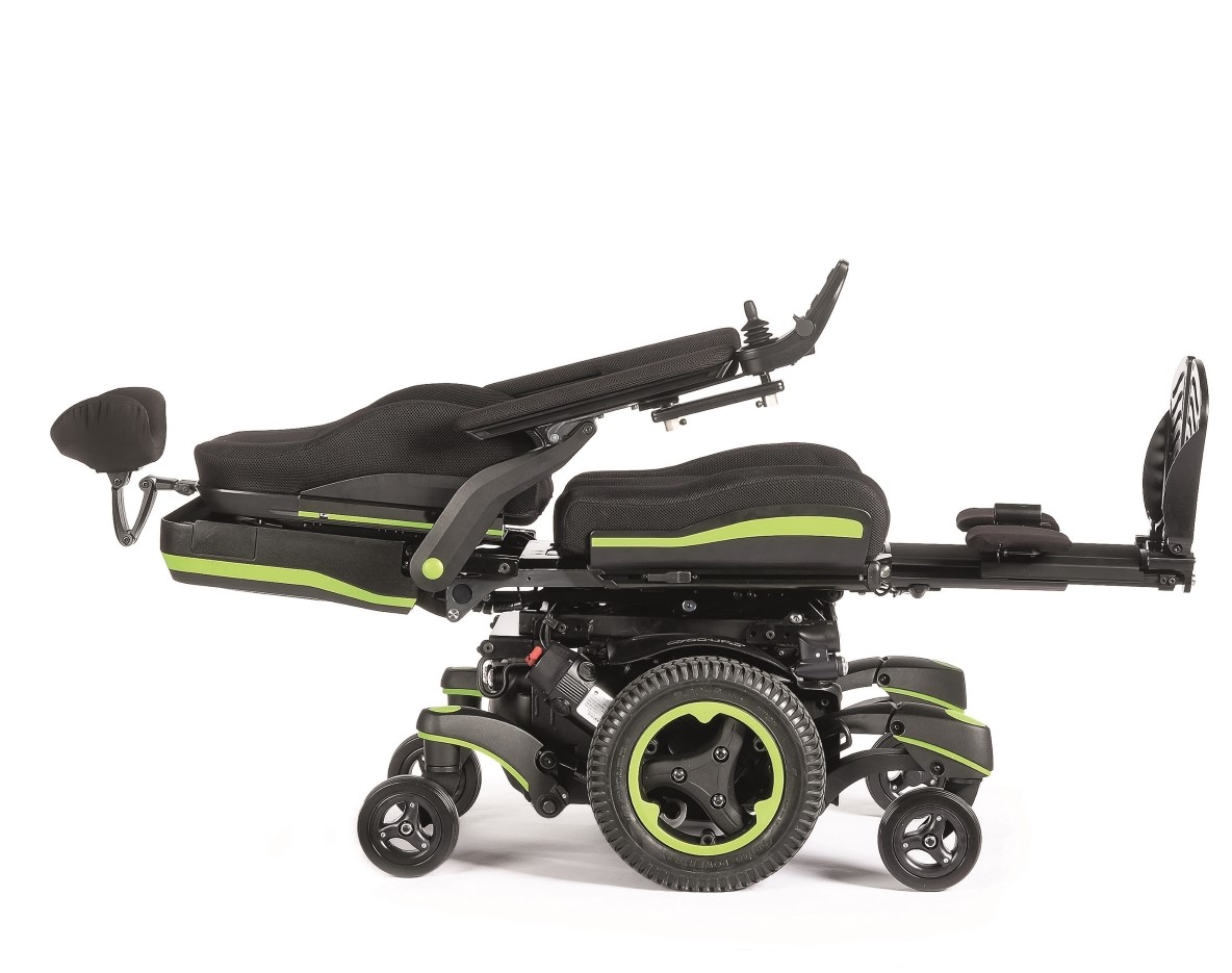 The Q700-UP power wheelchair is shown with bright green accents in the supine/up facing position