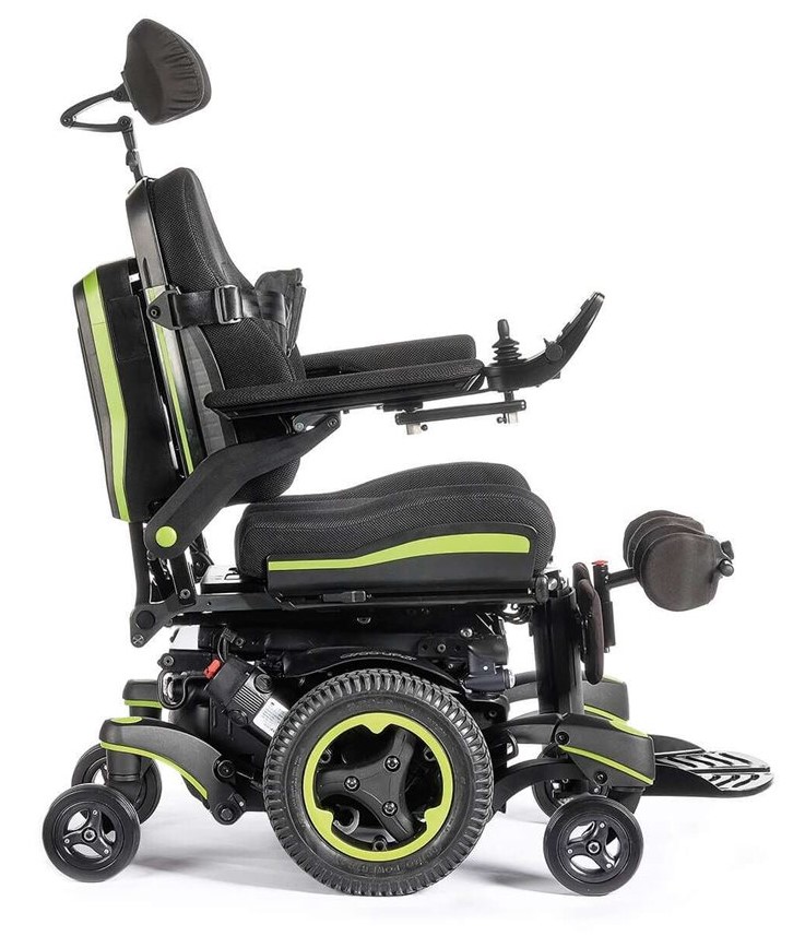 The Q700-UP standing wheelchair with bright green accents, shown from the right side