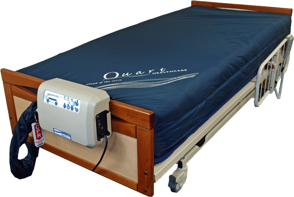 The Quart Diamond 8 Plus Low Air Loss Mattress shown on a hospital bed, attached to its air pump