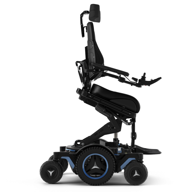 The Permobil M5 power chair with blue accents and rehab seating is shown in the ActiveReach position, using seat elevation and forward tilt to gain up to 4.5 inches of additional reach.
