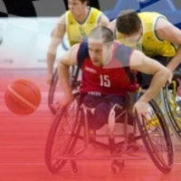 Several pro wheelchair basketball players are shown in action on a basketball court. thumbnail